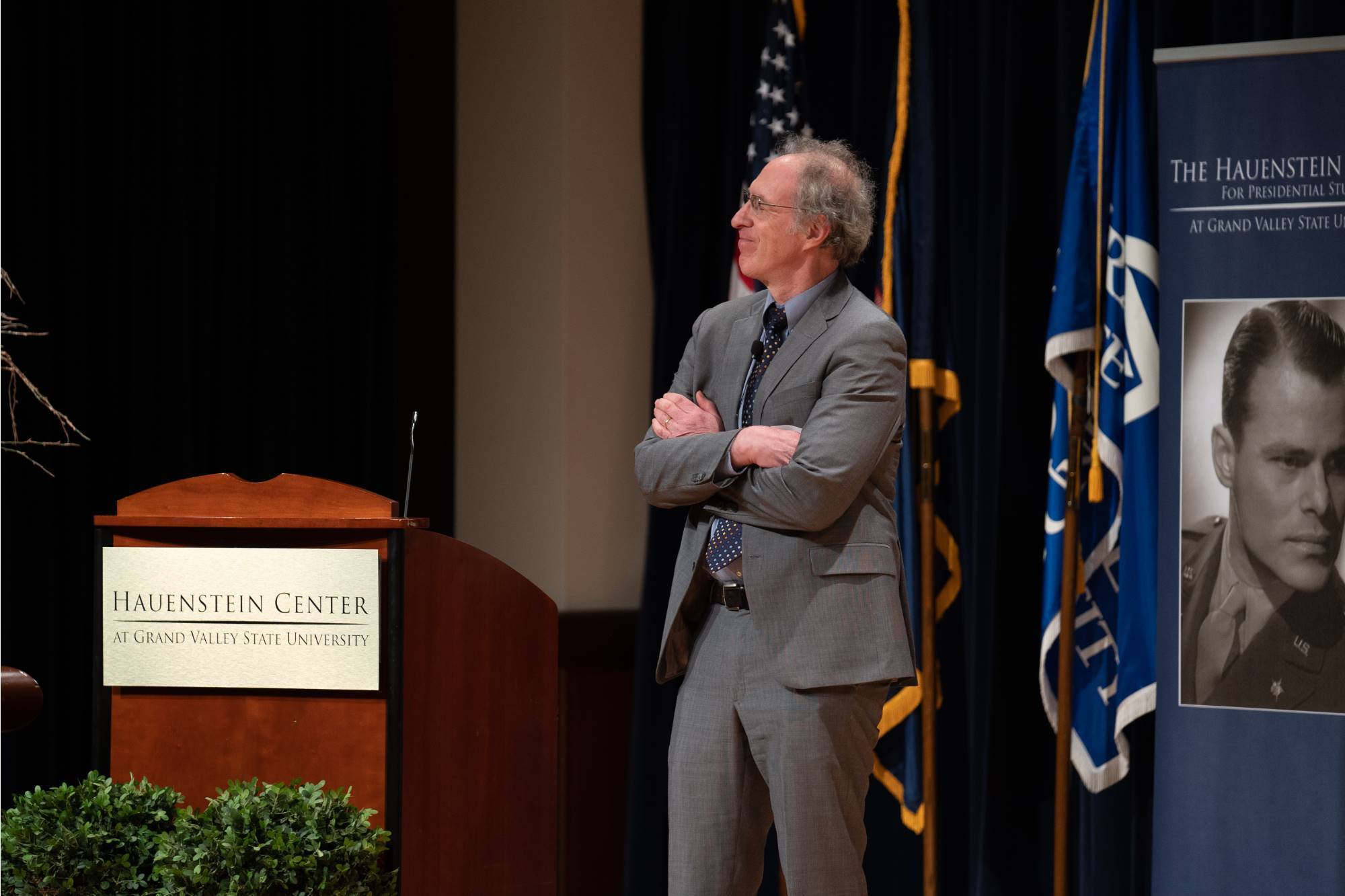 Guest speaker Steven Luxenberg speaks from the stage.